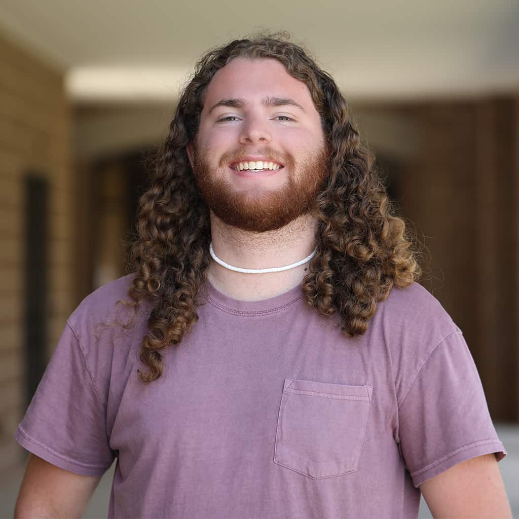A portrait of Ian Thompson smiling